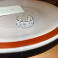 Detailed view of silver lace flower ring with cubic zirconia on a decorative plate - Silver Oval Style (7#)