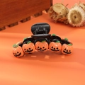 Detailed close-up of spooky orange pumpkin hair clip with wizard hat for Halloween parties - Classic Smile Pumpkin