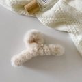 Beige plush rectangular hair claw clip with soft texture on white knit background - Crossed / Off White