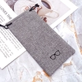 Grey linen drawstring pouch for sunglasses featuring a black glasses icon on marble - Gray