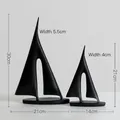 Modern minimalist black sailboat sculptures set of 2 in matte resin for home decor - A Pair Of Black Sailboats