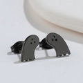 Macro shot of matte black stainless steel ghost stud earrings from side and front view - Black