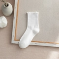 White crew socks for women featuring elegant lettuce edge cuffs and soft cotton texture - One Size / White