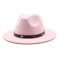 Detail of pink fedora with black leather band featuring silver stars and metal rivets - Pink