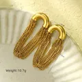 Detail of gold-plated long tassel earrings featuring a U-shaped stud and sleek chain fringe - Solid Tassel / 18K Gold / Gold Color (NMSE-C646-1)