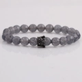 8mm gray matte beaded bracelet with a black crown charm and reflective background - Matte Grey