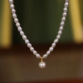 Elegant rice freshwater pearl necklace with large round pearl pendant and gold hardware - Single Pearl Clavicle Chain