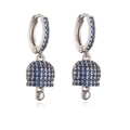 Detailed view of silver bell earrings with vibrant blue pavé zircon setting - Platinum Blue Zirconia