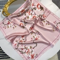 Detail of pink floral silk scarf with glossy satin finish and elegant flower pattern - Pink