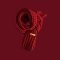 Close-up of red cable knit scarf texture featuring a handmade tag on dark red background - Handmade Cable Knit / Wine Red (Harajuku Style)