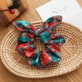 Christmas hair scrunchie with red and green plaid patterns and a white snowflake bow - Rabbit Ears Style / Christmas Red & Green