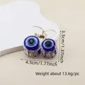 Detailed close-up of small evil eye hair claw clip featuring blue glittery beads - 4.5cm Cherry Style Eye Claw Clip