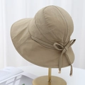Khaki wide-brim sun hat with polka dot texture and decorative bow on gold stand - Khaki