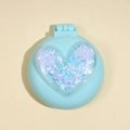 Light blue foldable travel brush with a sparkling rainbow heart and built-in mirror - M6P Heart Green