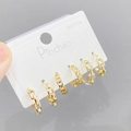 Close-up van gouden S925 zilveren oorbellen met Cubaanse schakels en ingelegde zirkonia - Cubaanse Ketting Stijl (E612) / 3 paar set / Goud