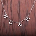 Collana in acciaio inossidabile argento lucido con ciondolo HOPE su fondo legno scuro - Color Acciaio
