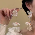 Detailed close-up of long floral tassel earrings with colorful beads and petals - Chiffon Petal Colorful Beaded Tassel Style / 15# 925 Sterling Silver Earring Post - White - Colorful