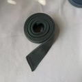 Detail view of a dark green wool coat belt with precise stitching and soft texture - Grey Green