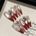 Uñas postizas stiletto largas rojas con cruz de strass y efecto ojo de gato perlado - Extra Pequeño (XS)