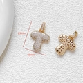 Macro detail of cubic zirconia cross pendant showing 29x20mm dimensions and golden back - Letter T