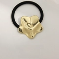 Minimalist gold star metal hair tie with durable black elastic band for high ponytail - Embossed Five-Pointed Star Gold