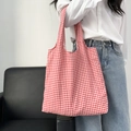 Retro red and white checkered canvas tote bag shown as a casual shoulder bag on a model - Red Gingham Double-layer Vest Style