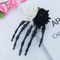 Gothic Halloween skeleton hand hair clip with black and white roses on a white backdrop - Black and White Symphony Hairpin / Black & White
