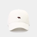 Close-up of brown polar bear embroidery on minimalist off-white cotton baseball cap - Adjustable / White