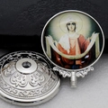 Close-up of silver metal religious ornament featuring a Virgin Mary resin dome detail - Silver-15 (Vintage Virgin Mary)