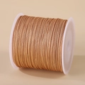 0.8mm golden braided nylon cord wrapped on a spool for DIY jewelry making - Lotus Pink