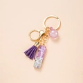 Purple glitter resin letter keychain with golden tassel and lobster clasp accessory - Letter I