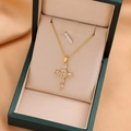 Elegant gold titanium cross necklace with sparkling cubic zirconia on a luxury jewelry box - 9214 / Gold