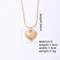 Gold-tone heart necklace with letter P pendant and shimmering cubic zirconia detailing - Letter P
