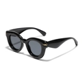 Occhiali da sole cat-eye neri con montatura spessa, rivetti dorati e lenti grigie - Nero Lucido / Grigio