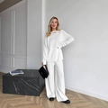 Set in maglia bianca con top con spacco sul collo e pantaloni larghi a vita alta - S / Bianco