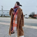 Colorful plaid tassel scarf featuring purple and orange patterns on a casual model - Purple Blue Orange