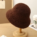 Detailed texture of dark brown faux shearling knit bucket hat on a wooden stand - M (56-58cm) / Coffee