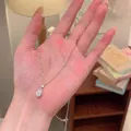 Elegant silver teardrop pendant necklace with sparkling halo crystals for women - Teardrop Rhinestone Style (X1545 Silver)
