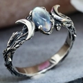 Retro moonstone ring with crescent moon and vine design on natural grey rock background - US 7 / Antique Silver