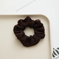 Detailed view of dark brown ribbed knit fabric scrunchie on a beige ceramic tray - Dark Coffee