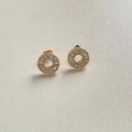 Golden circular stud earrings featuring luxury rectangular-cut clear gemstones - Gold White Zirconia