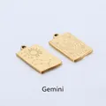Detail of gold Gemini zodiac rectangle pendants with engraved celestial patterns - Gemini
