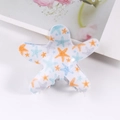 Blue starfish hair claw clip with cartoon smile face pattern on white countertop - Transparent Mixed Color Starfish (C9-2-26)