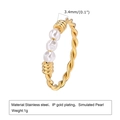 Macro shot of 1g gold twisted stainless steel ring with 3.4mm simulated pearls - US 7 / Gold