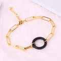 Detail of gold-plated paperclip chain bracelet with a black micro-pave encrusted charm - Round Dark Blue Zirconia Bracelet