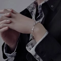 Men's silver hip-hop chain necklace with a star pendant styled on a wrist - High Street Cross Star Pendant Bracelet
