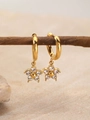 Golden flower drop earrings with clear rhinestones on natural stone background - April White (Diamond/Crystal Color)