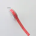 Red Christmas ribbon with white Merry Christmas text and wavy edges, 1.6cm width - 1.6cm Red Background With White Lettering