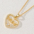 Macro shot of gold heart pendant necklace with MUM lettering and white zircons - Heart MUM/Hollow Letter/White Zirconia