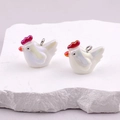 Pair of iridescent white resin chicken pendants with silver metal rings on stone - AB Colorful Rooster